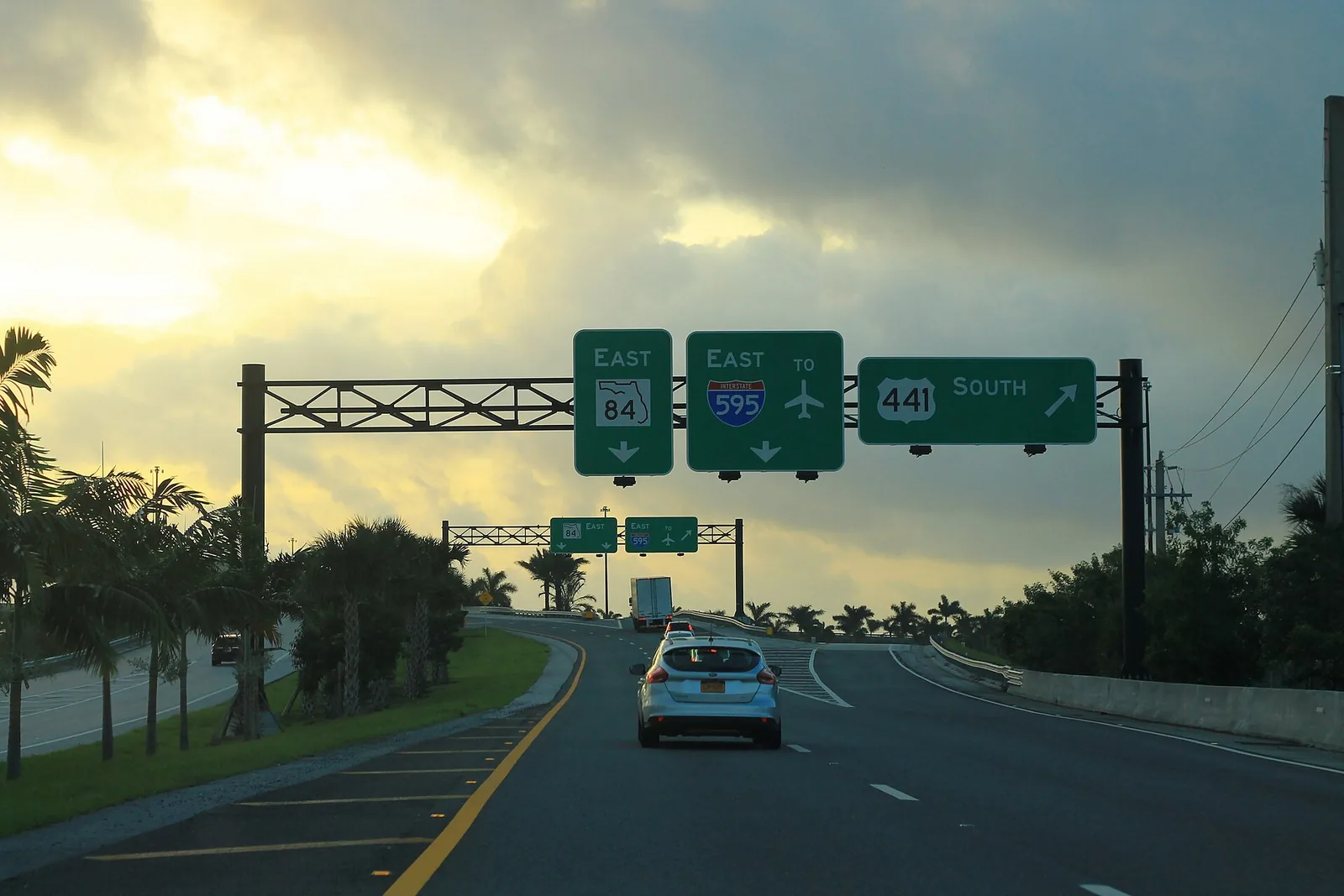 Signs on the Florida's Turnpike ramp at Exit 54 in Davie point to State Road 84, I-595 and U.S. 441 (State Road 7).
