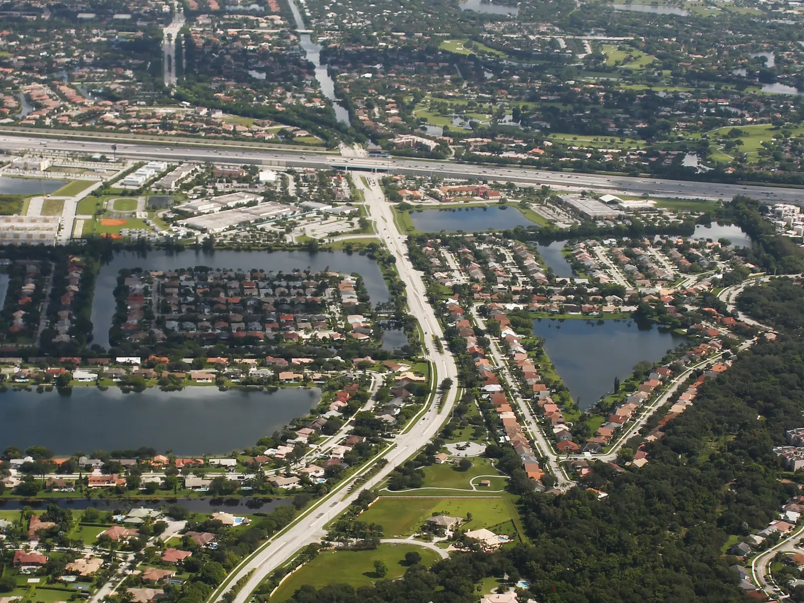 Nob Hill Road, the west edge of the Pine Island Ridge area, runs north toward I-595 past lakes, homes and open land in this aerial view.
